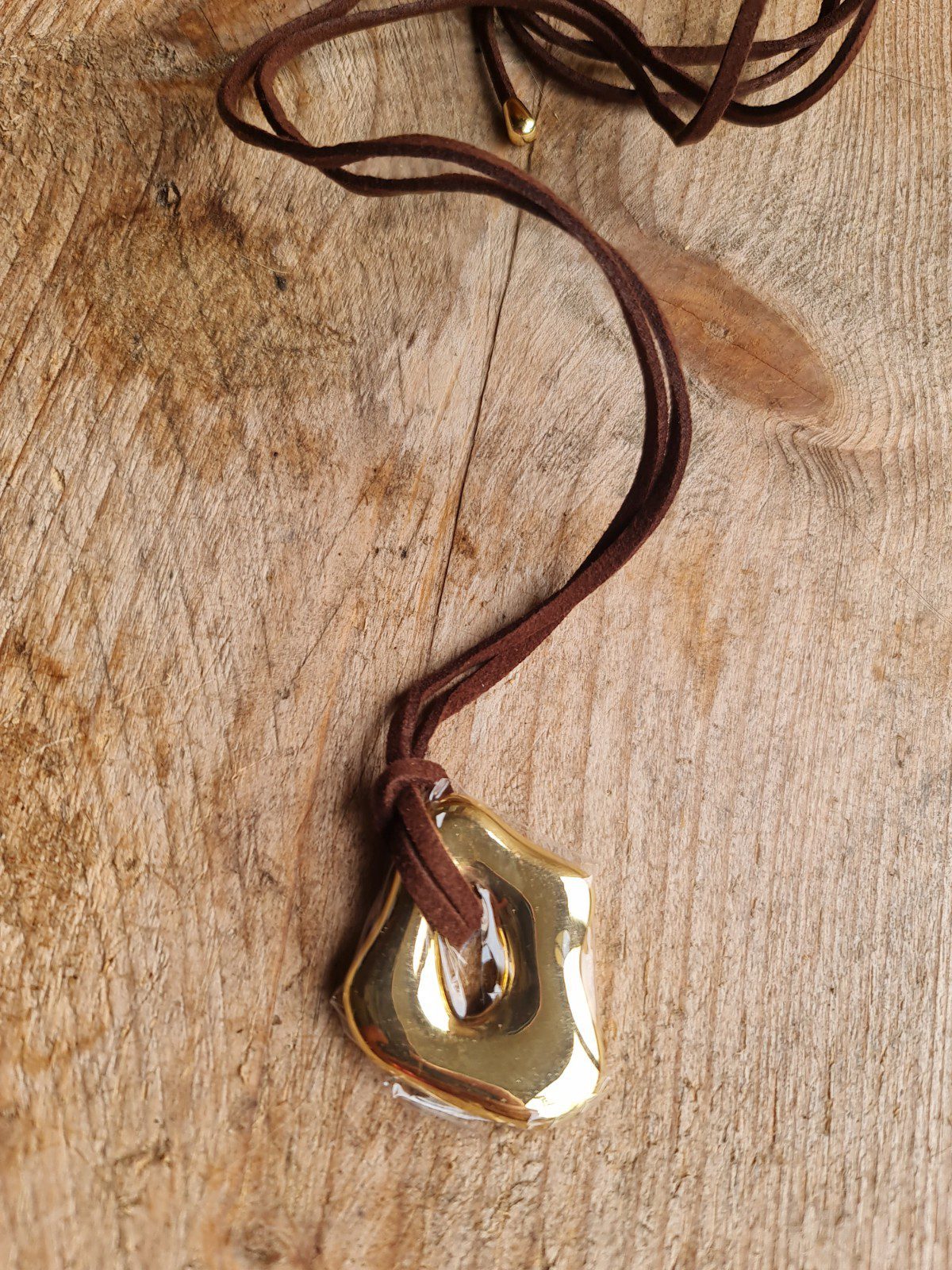 Stoere ketting van roestvrij staal met een fantasie GOUDEN hanger - lange koord