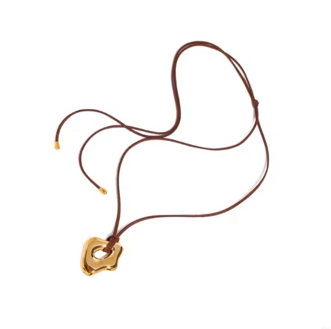 Stoere ketting van roestvrij staal met een fantasie GOUDEN hanger - lange koord