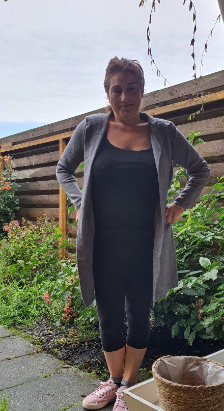 Warme vest in GRIJS kleur met capuchon en zijzakken voor dames maat 38/40